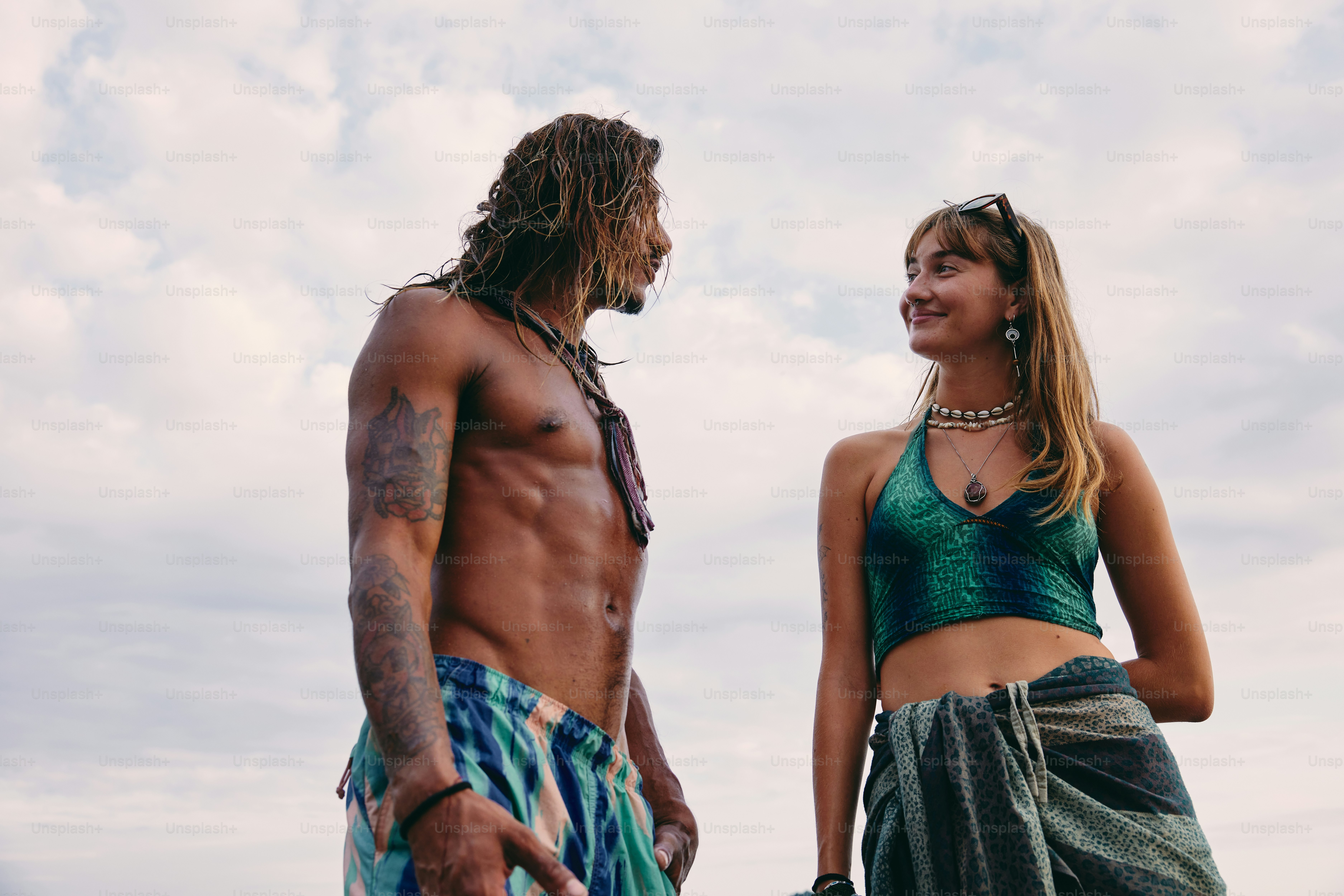 a man and a woman standing next to each other