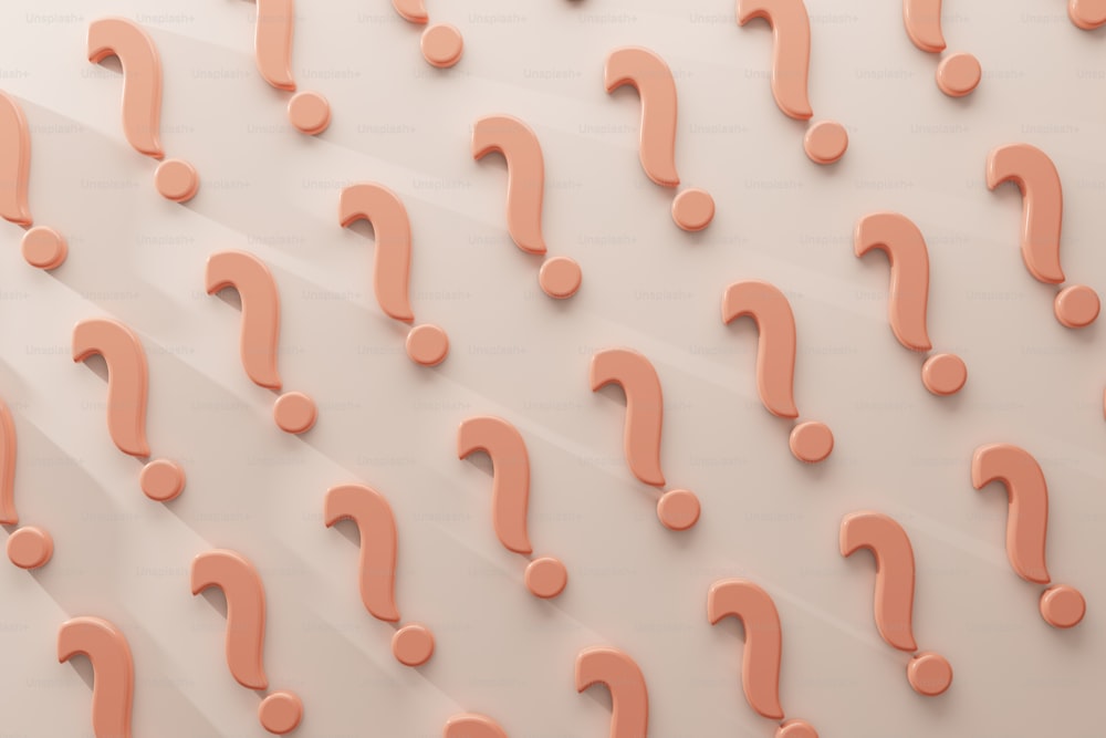 a large group of question marks on a wall