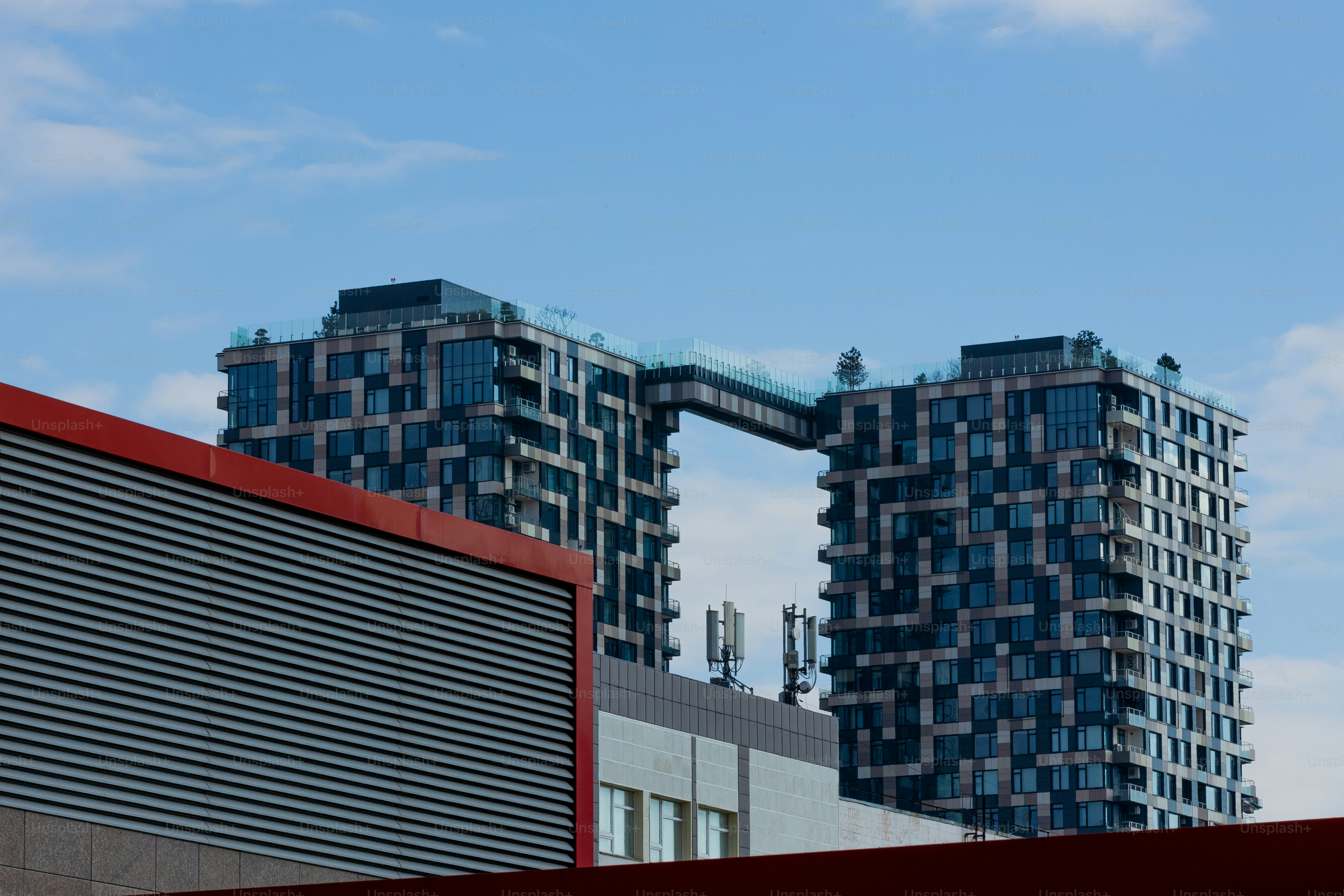 a couple of tall buildings sitting next to each other