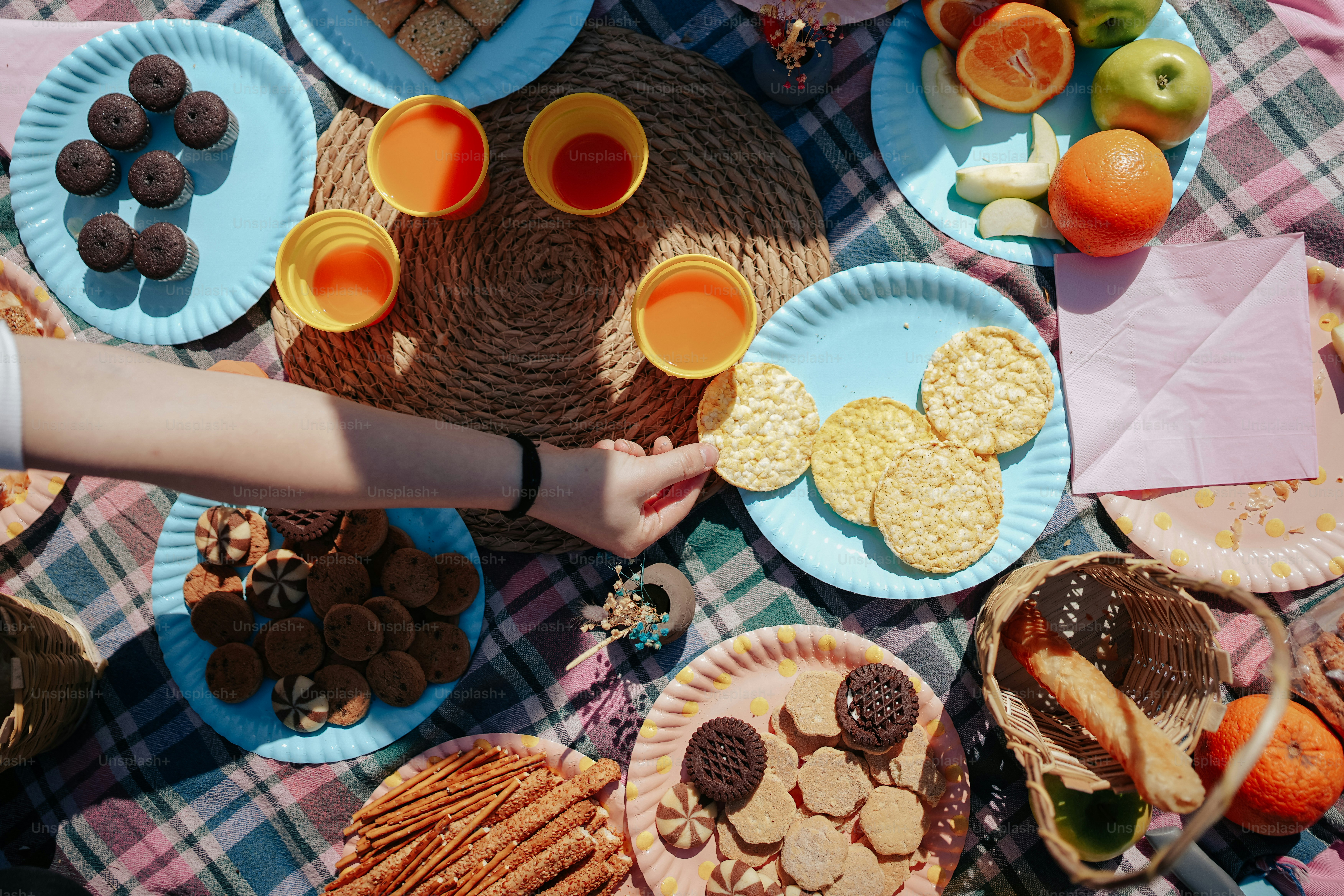 a table topped with plates of food and drinks