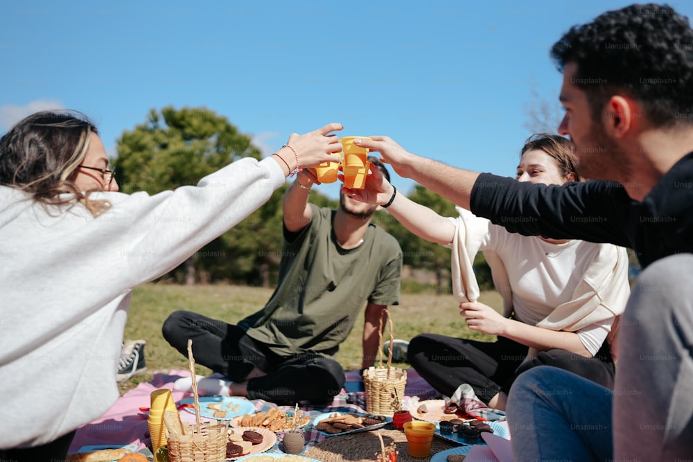 a group of people sitting around a picnic table