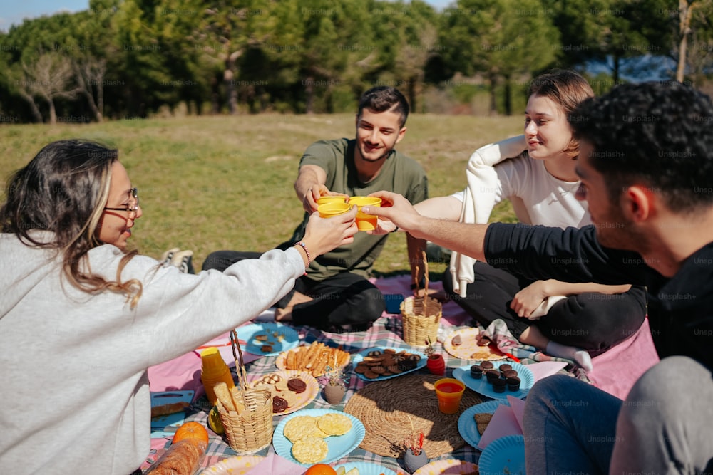 a group of people sitting around a picnic table