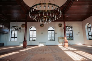 a large room with a chandelier hanging from the ceiling