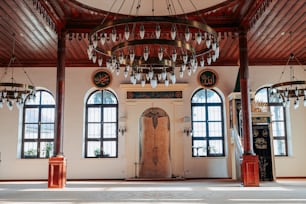 a large room with a chandelier hanging from the ceiling