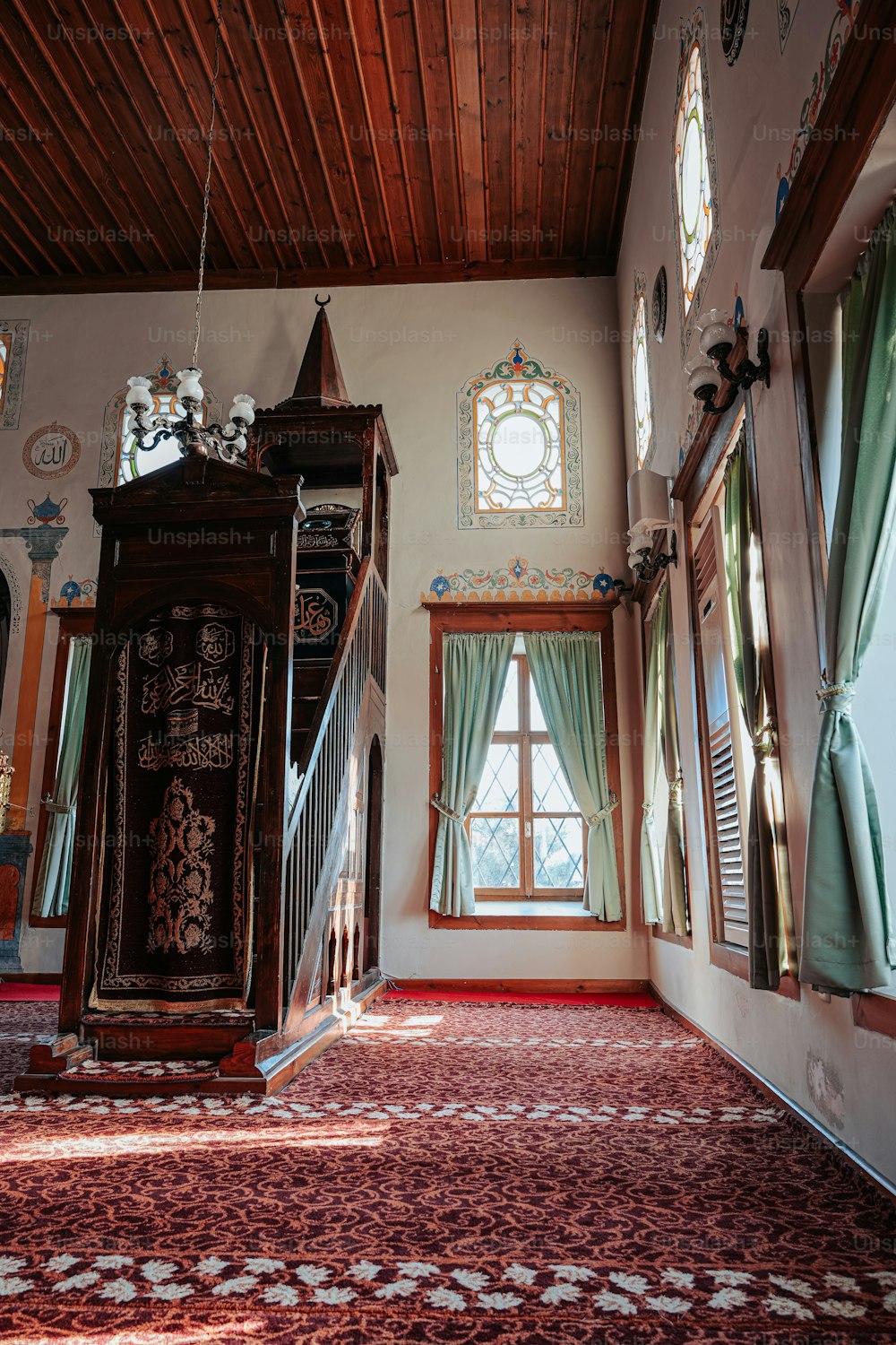 a room with a large wooden grandfather clock in it