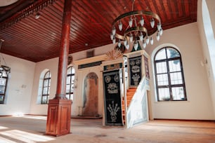 a large room with a chandelier and windows
