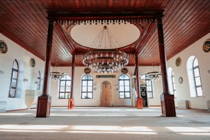 a large room with a chandelier hanging from the ceiling