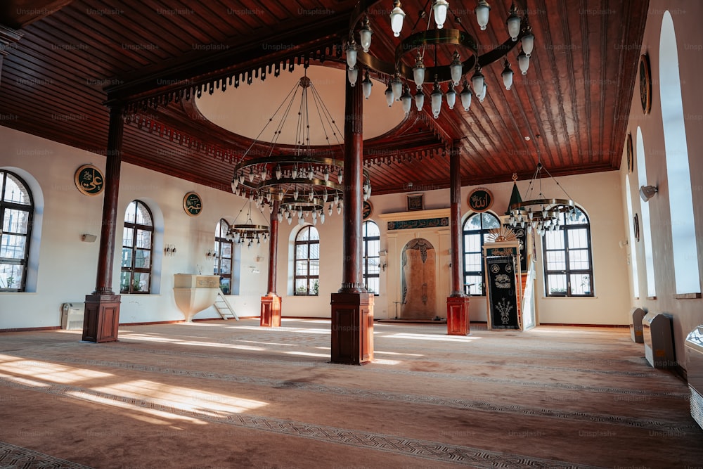 a large room with a chandelier hanging from the ceiling