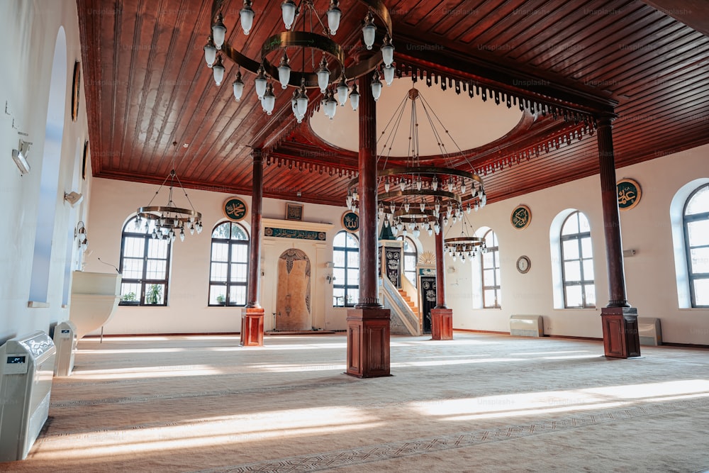 a large room with a chandelier hanging from the ceiling