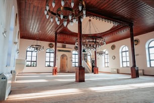 a large room with a chandelier hanging from the ceiling