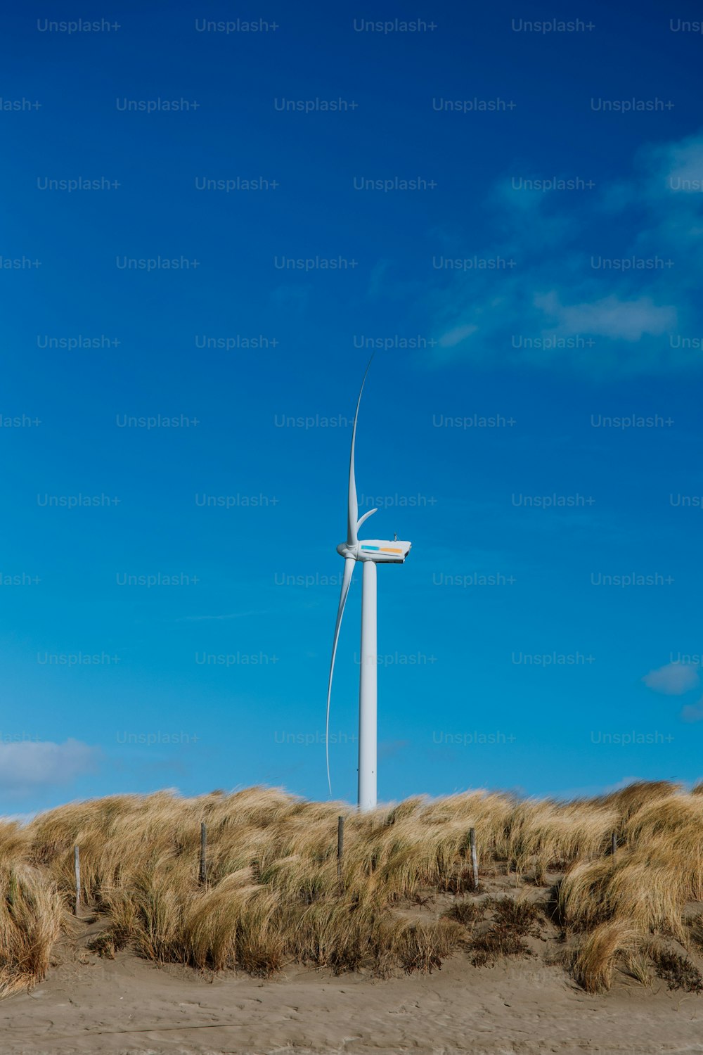 a wind turbine in the middle of a field