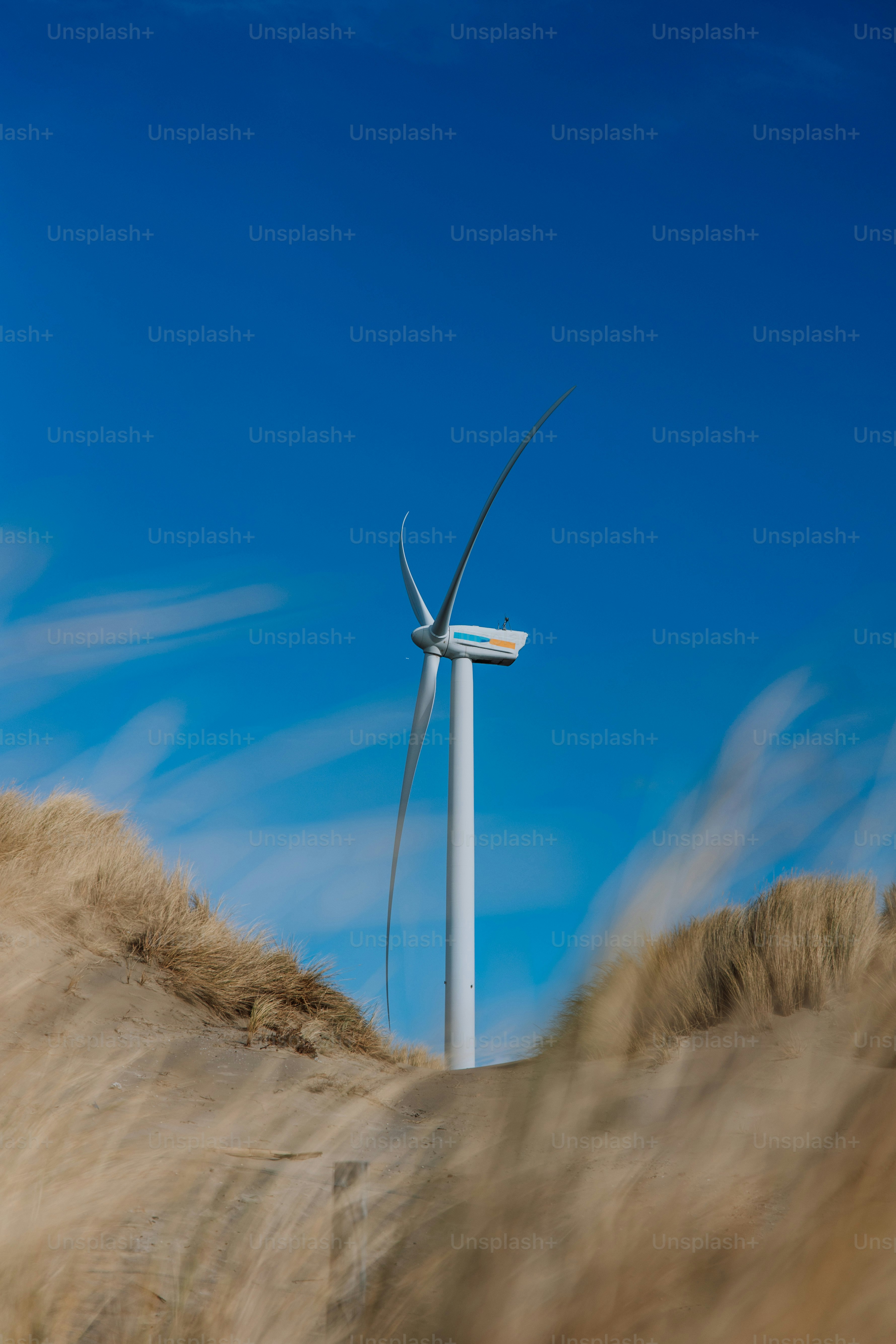 A wind turbine in the middle of a field photo – Clean energy Image on ...