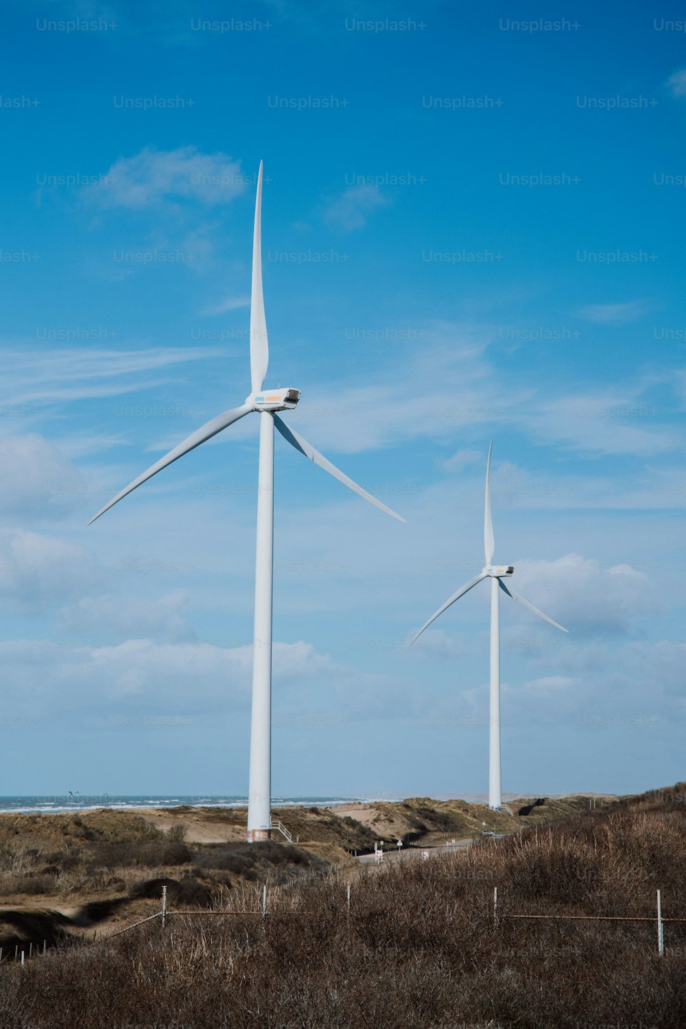 a group of wind turbines in a field