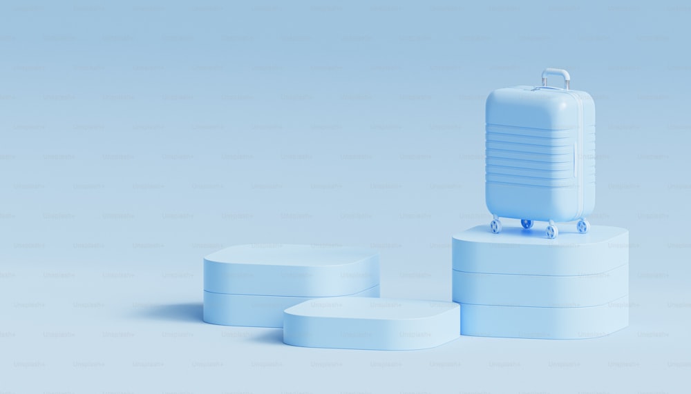 a set of three white containers with a blue suitcase on top