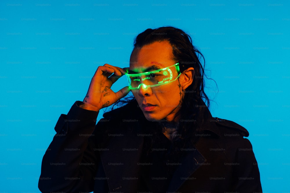 a woman wearing neon glasses against a blue background