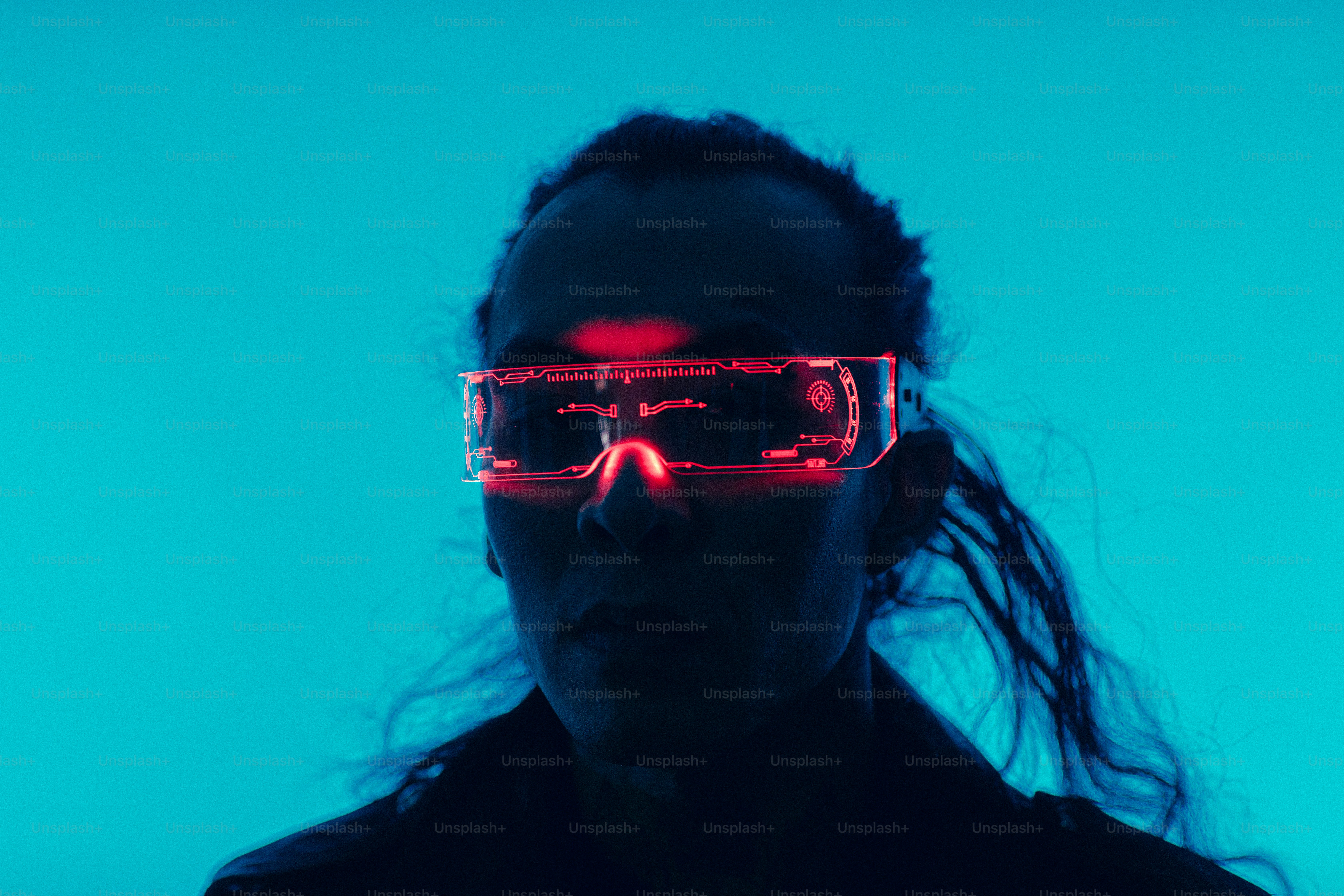 a woman wearing glasses with a red light on her face