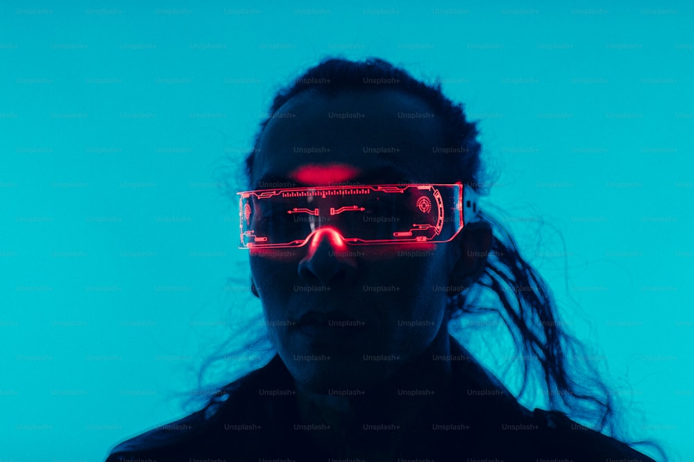 a woman wearing glasses with a red light on her face