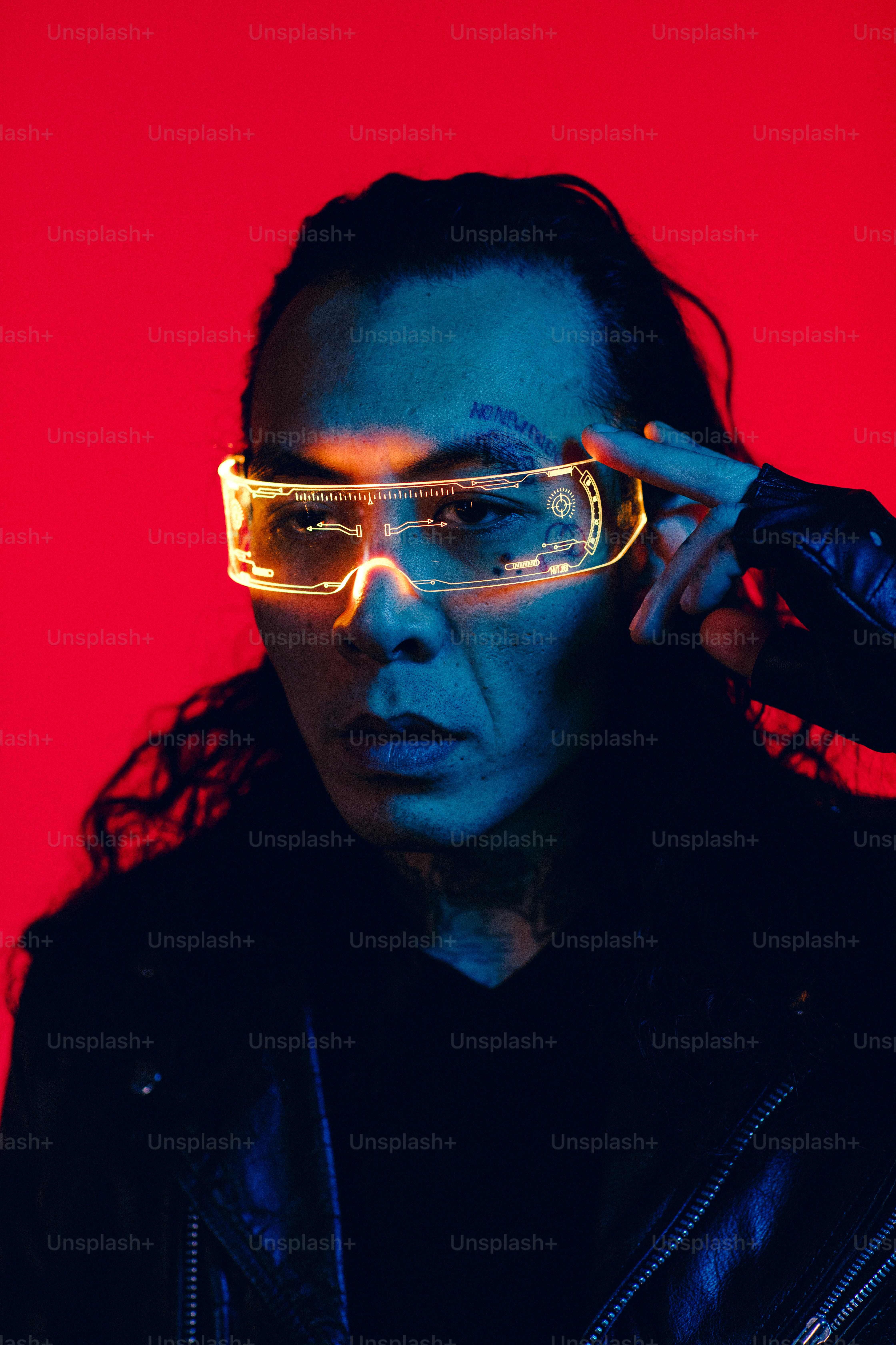 a woman in a leather jacket and sunglasses