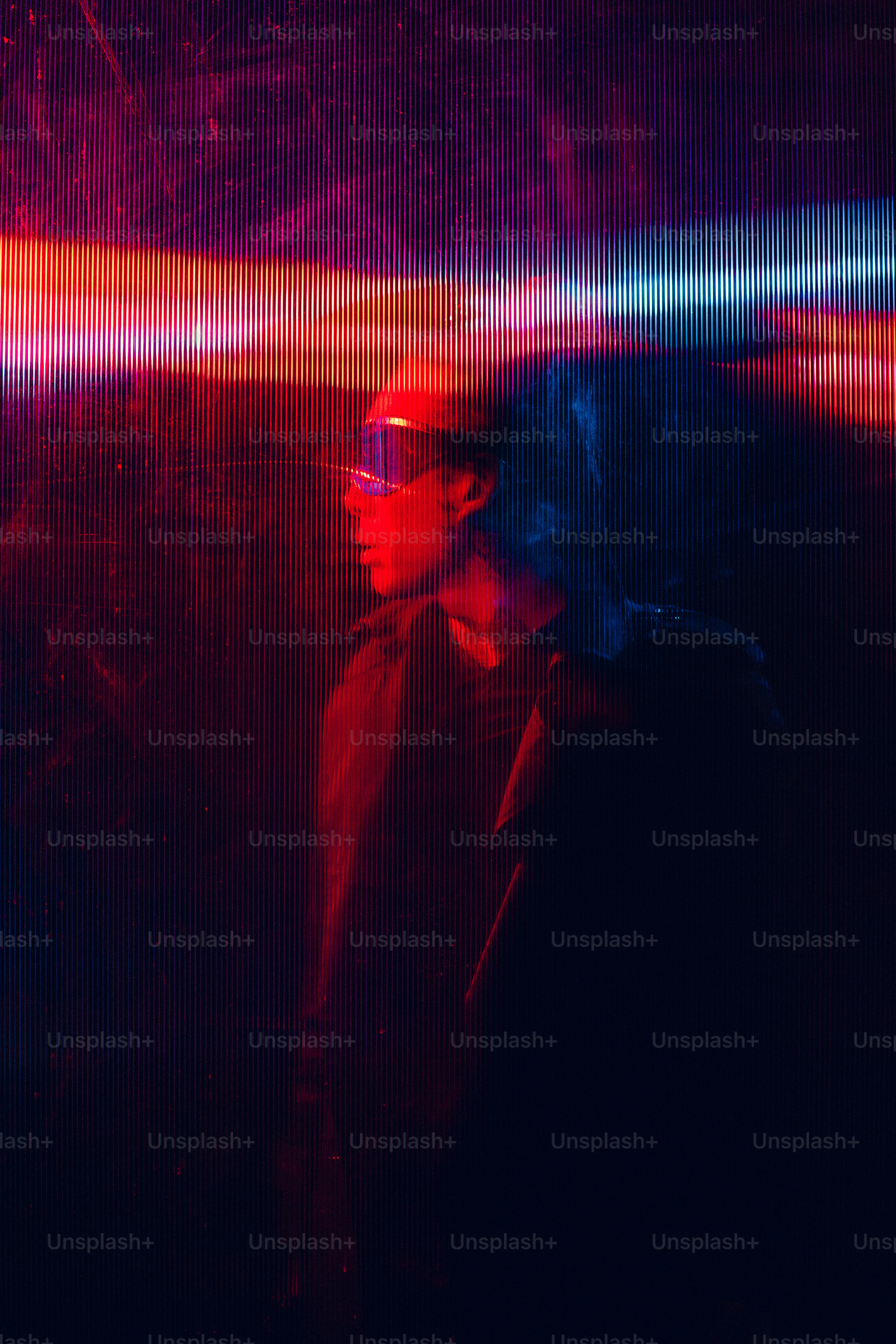 A man standing in front of a red and blue light photo – Technology ...