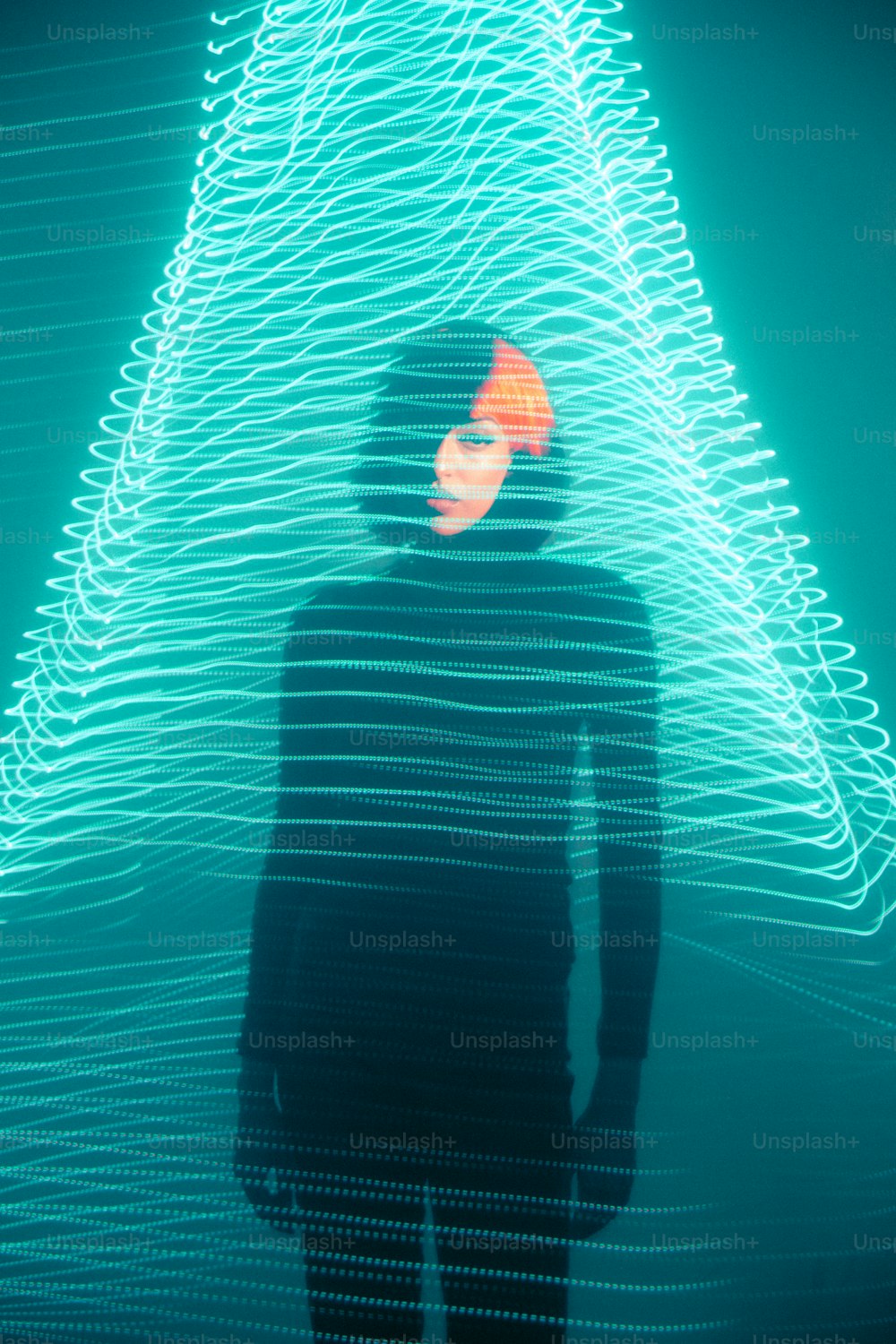 a man standing in front of a christmas tree