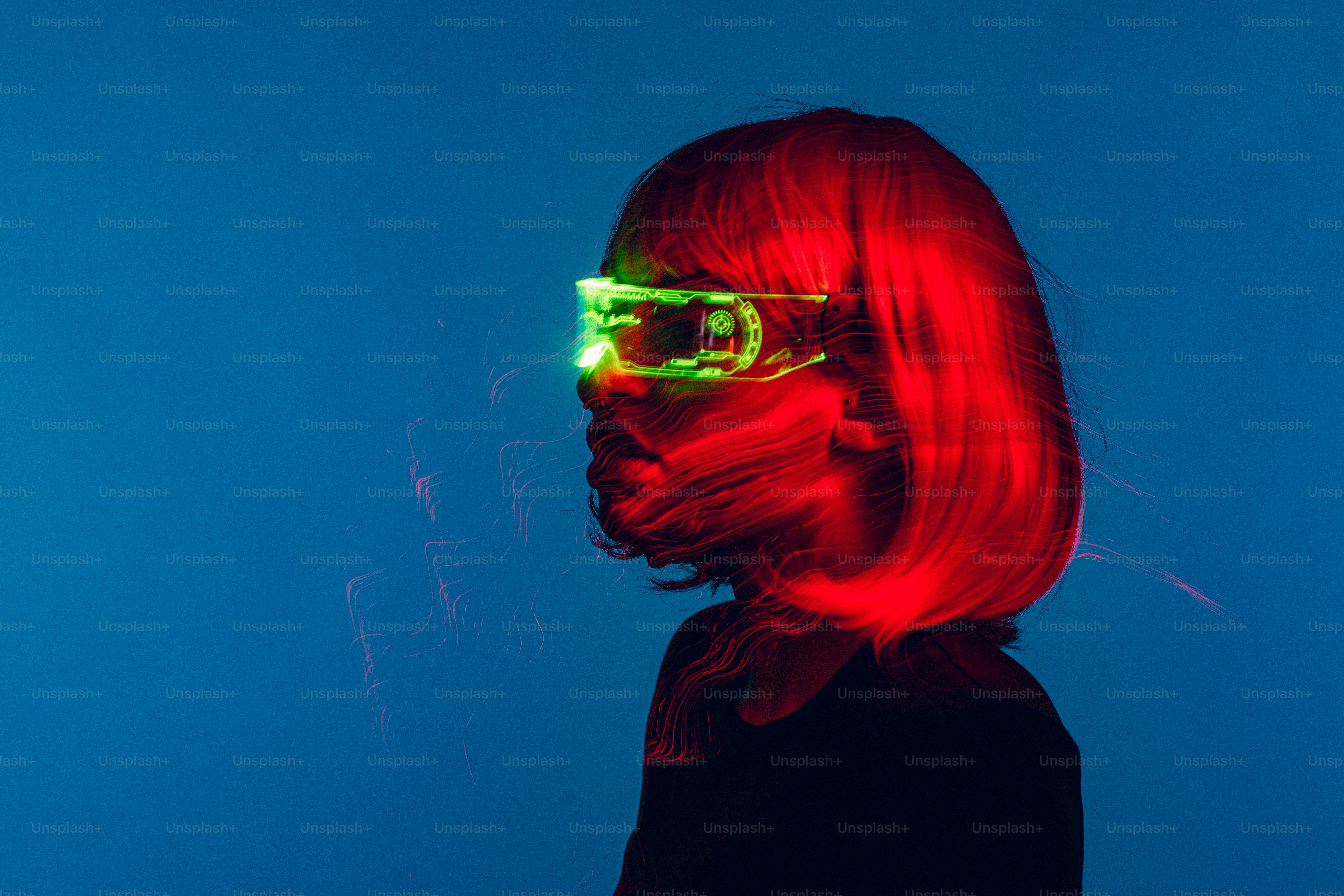 a woman with red hair and neon glasses