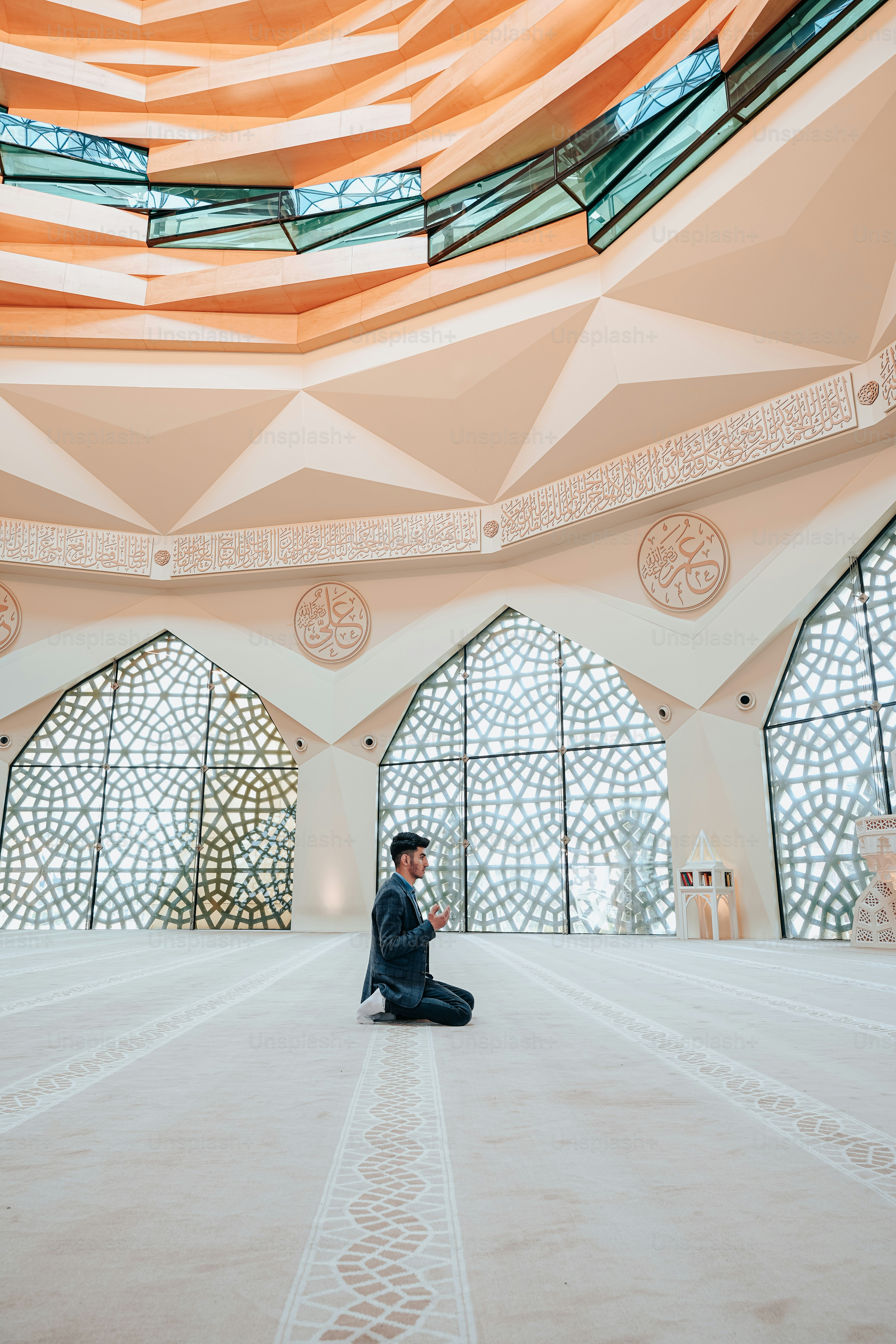 a man sitting on the floor of a building