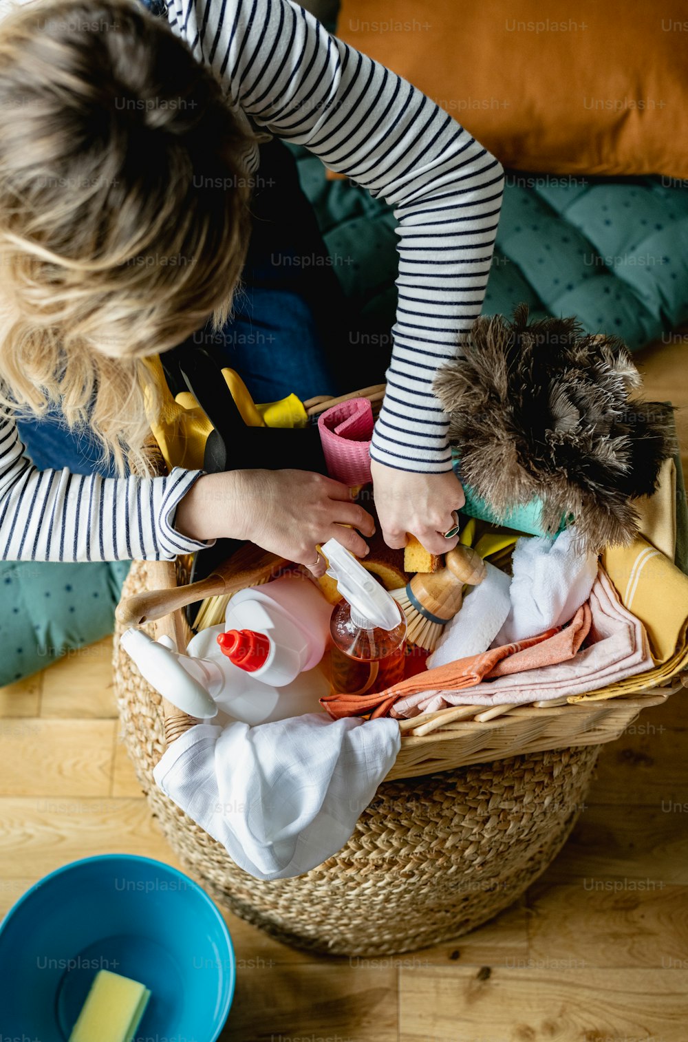 a woman holding a stuffed animal in a basket