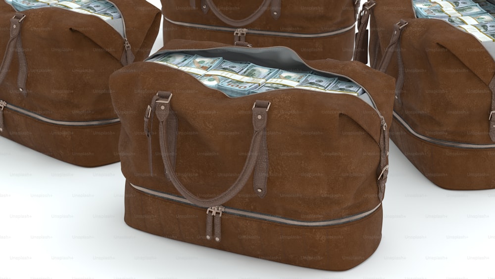 a set of four brown bags with money in them