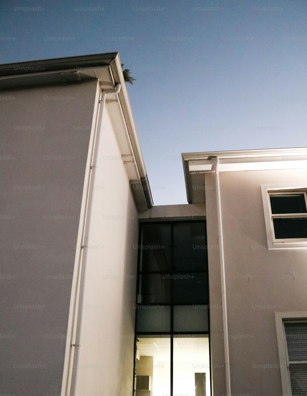 a bird is perched on the roof of a building