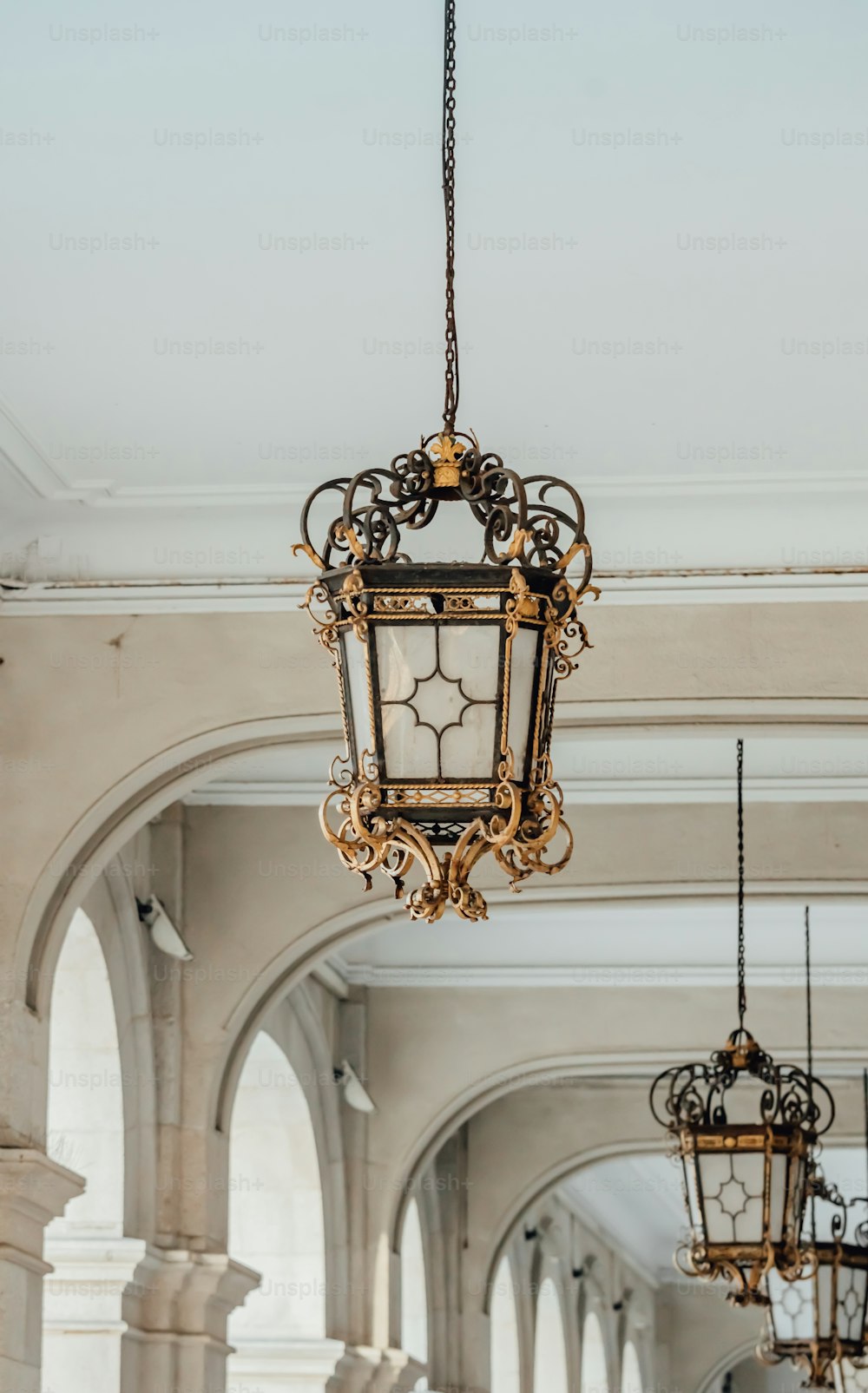 a chandelier hanging from a ceiling in a building