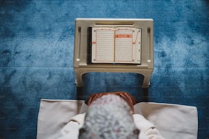 a person laying down in front of a computer monitor