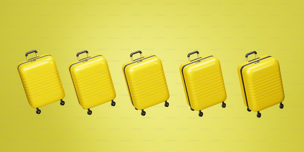 a group of four yellow suitcases sitting next to each other