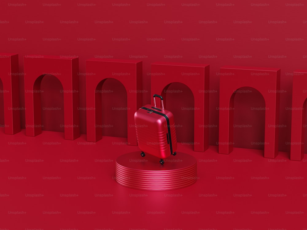 스탠드 위에 앉아있는 빨간 수하물 조각