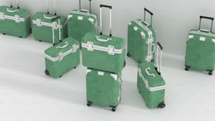 나란히 앉아 있는 녹색 여행 가방 그룹