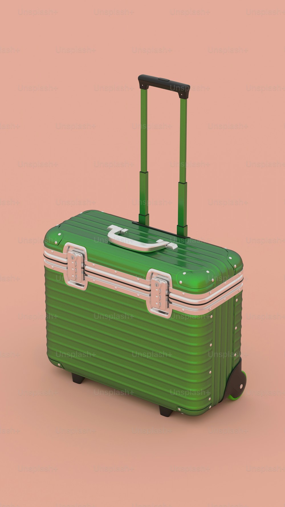 a green suitcase sitting on top of a pink background