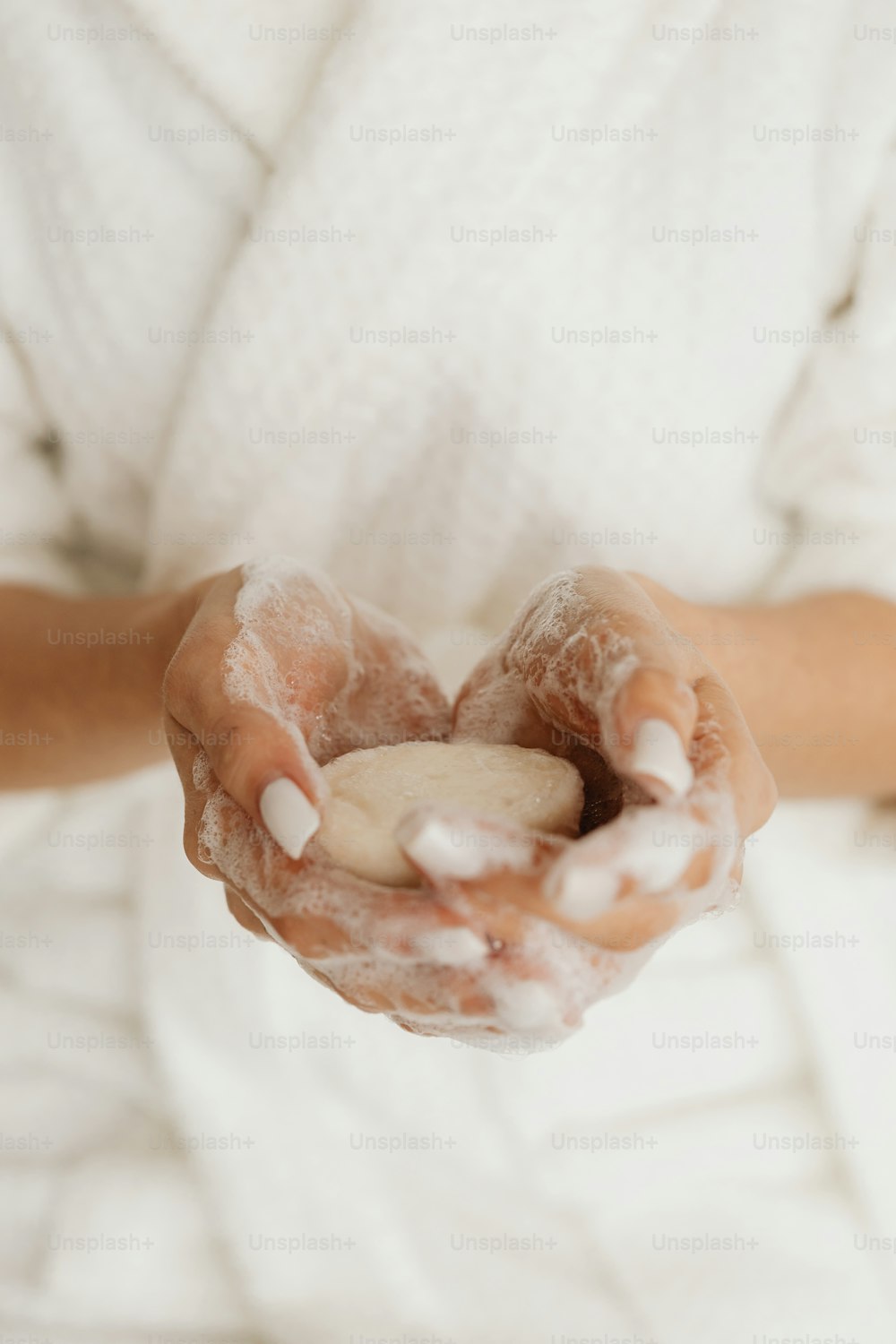 a person holding a cookie in their hands