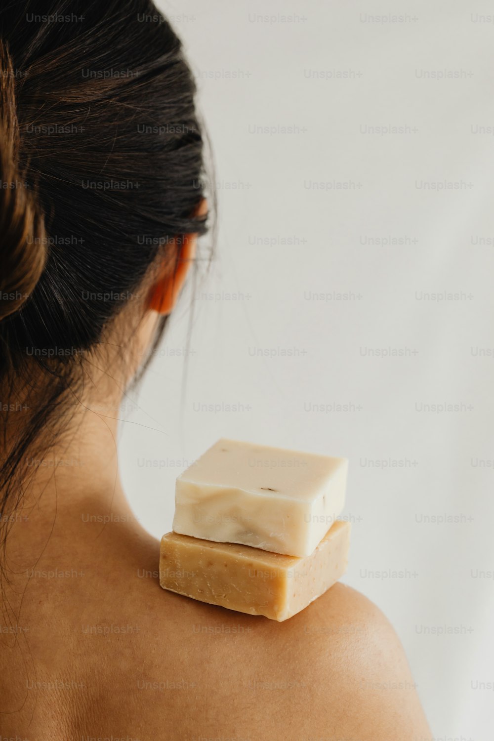 a woman with a piece of soap on her shoulder
