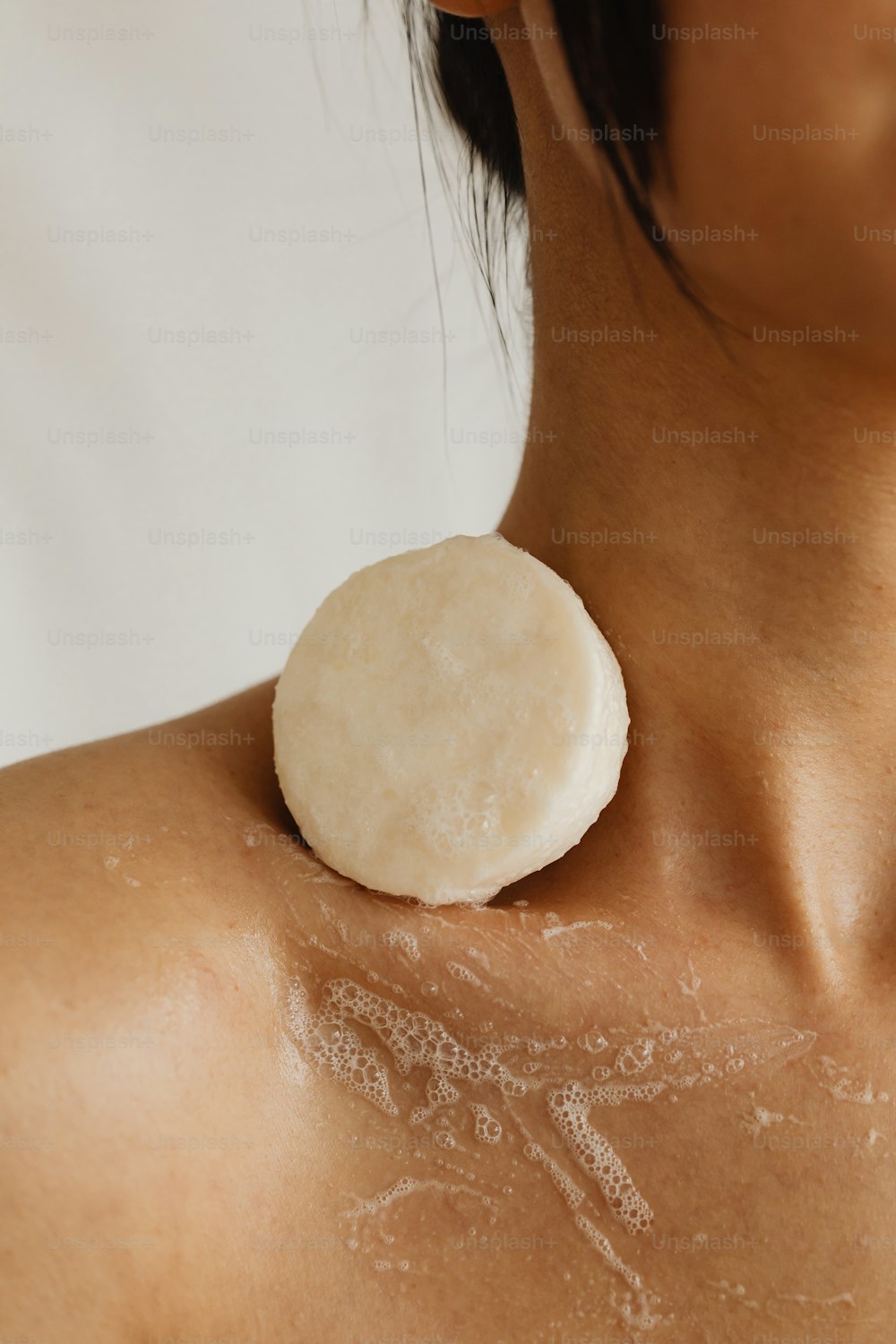 a woman with a piece of food on her shoulder