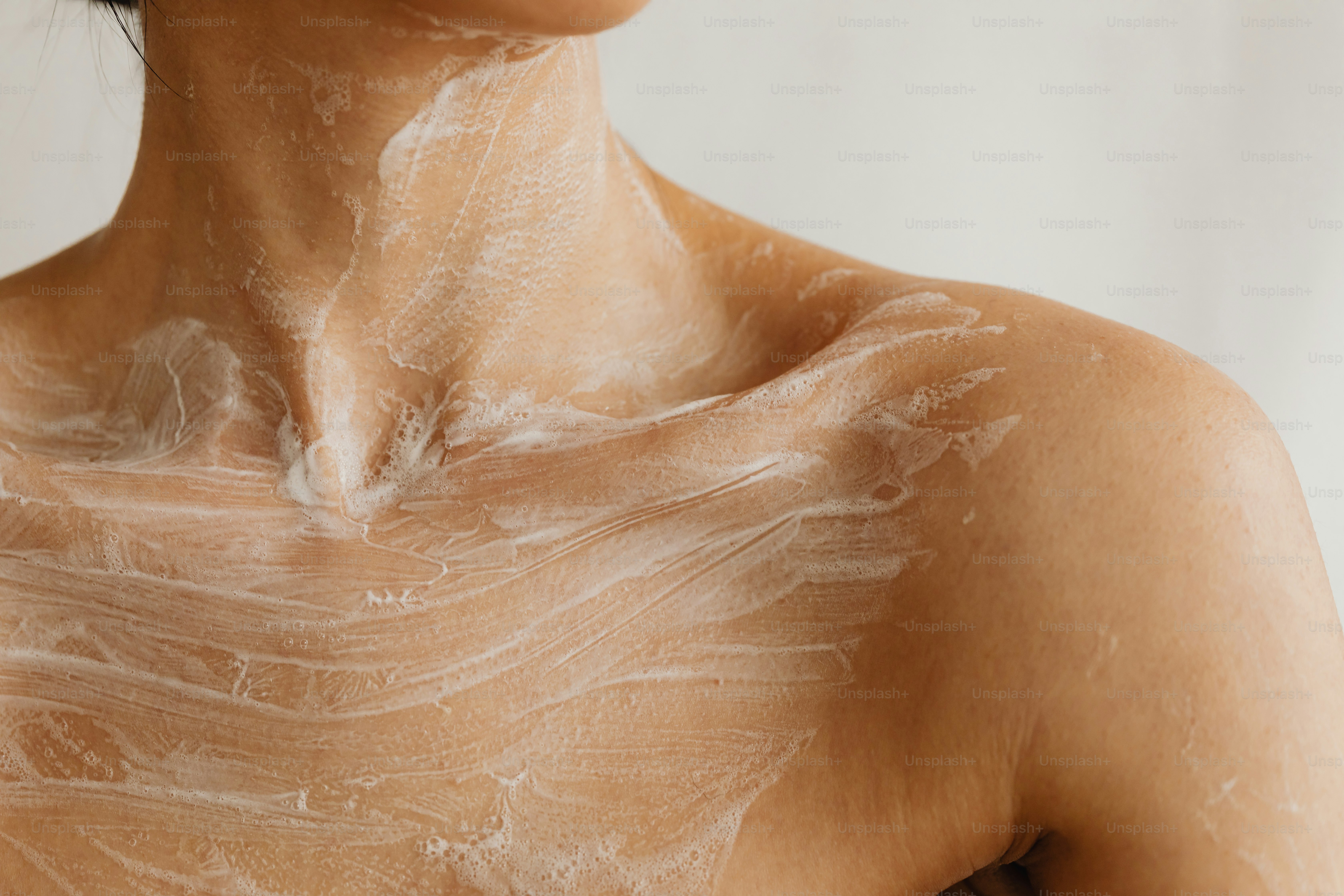 a woman's back with a lot of white paint on it