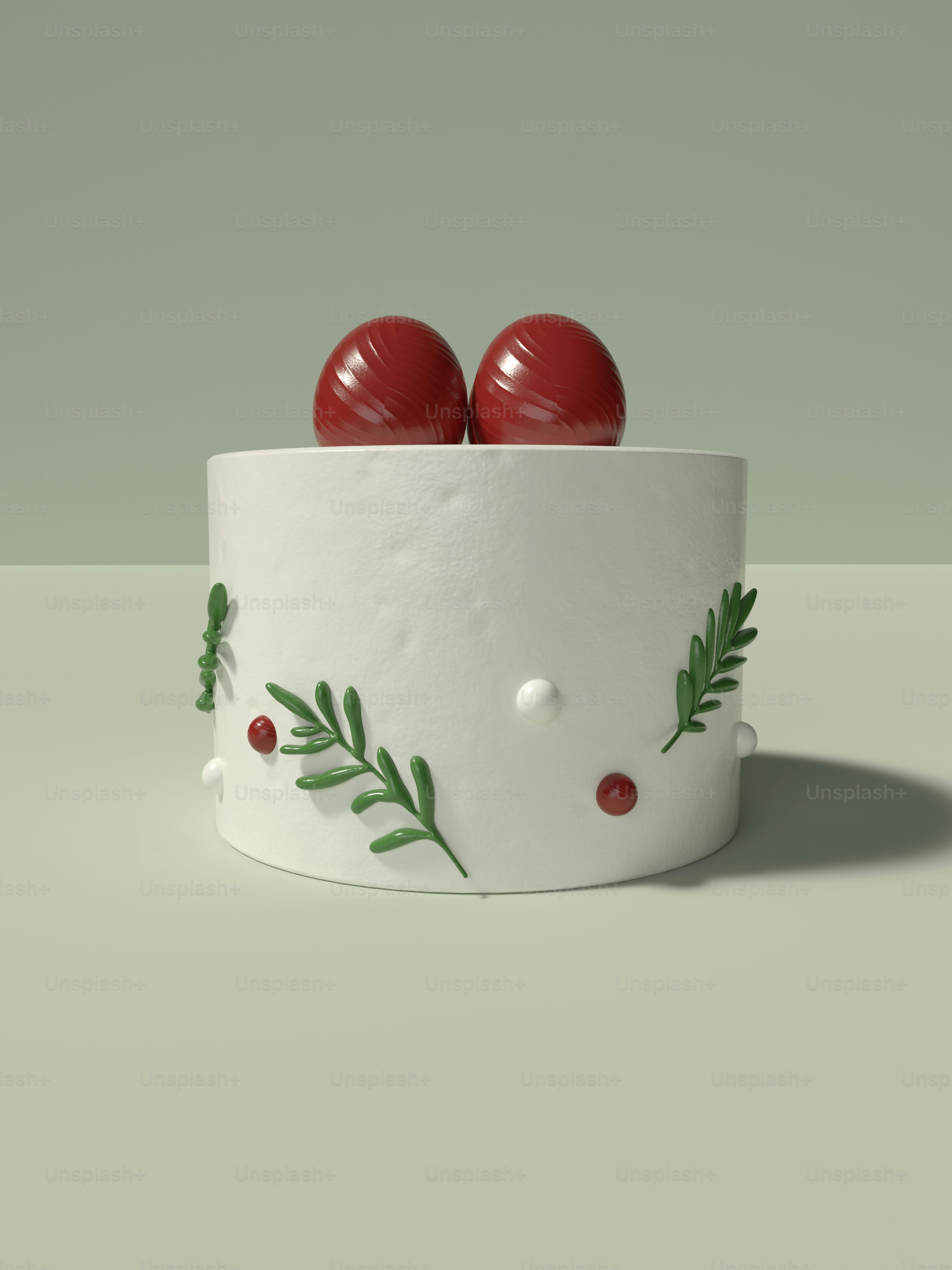 a white cake with two red apples on top of it