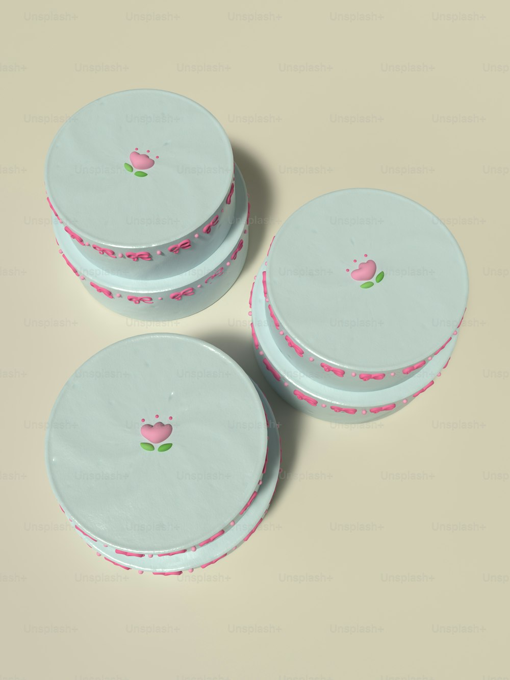 three white plates with pink flowers on them