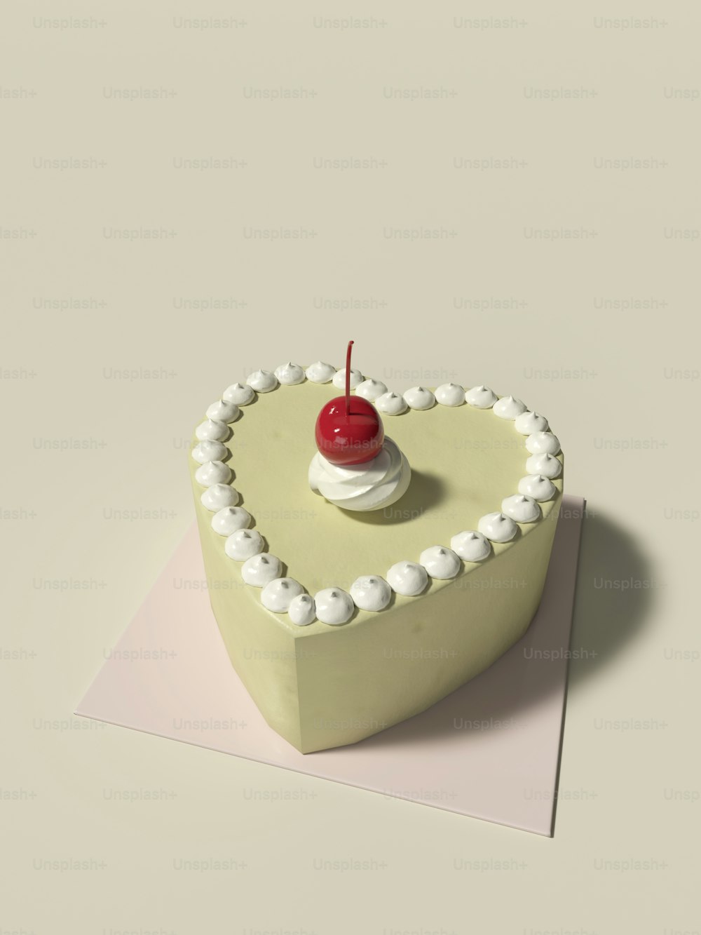 Un gâteau en forme de cœur avec une cerise sur le dessus