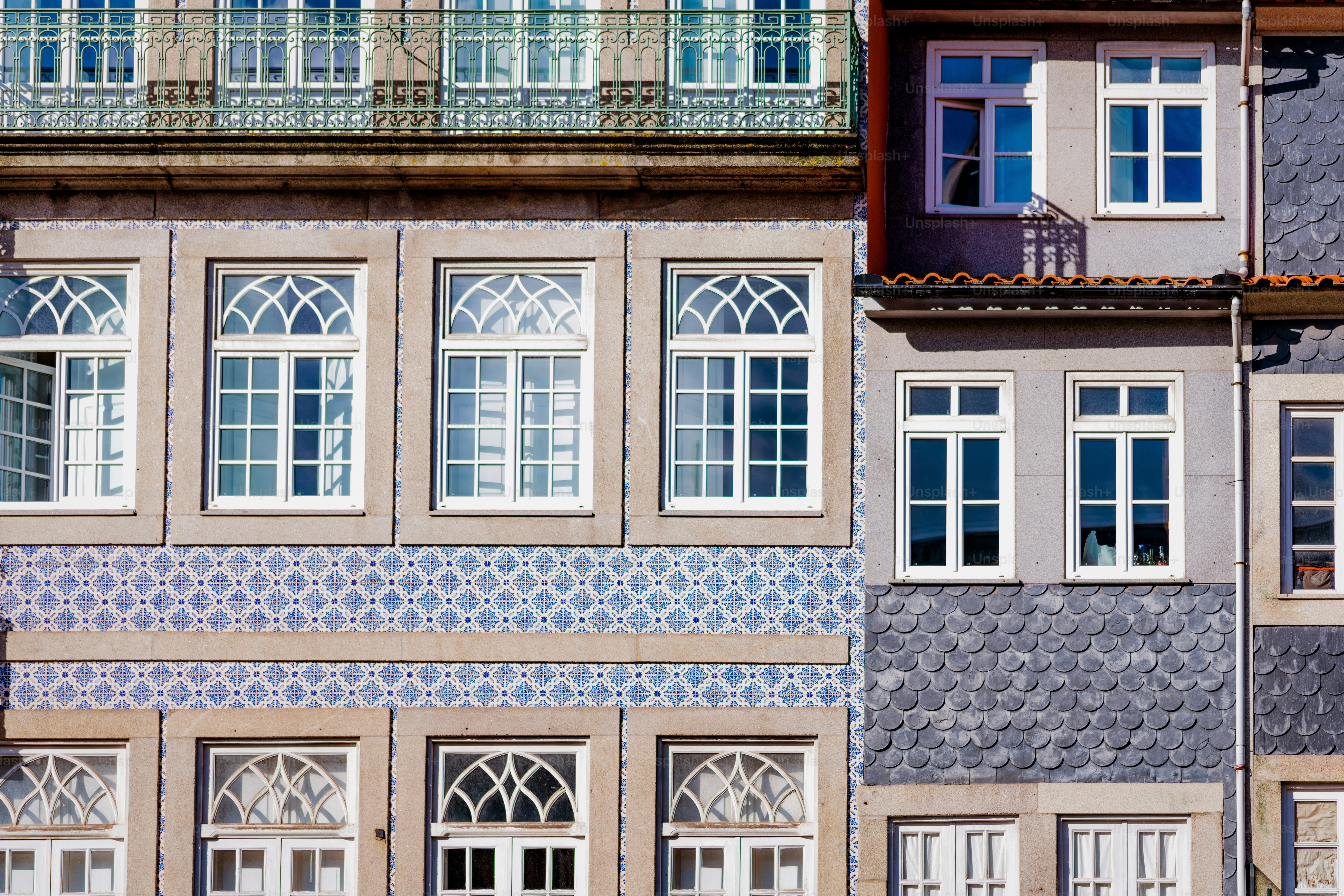 a tall building with many windows and a clock