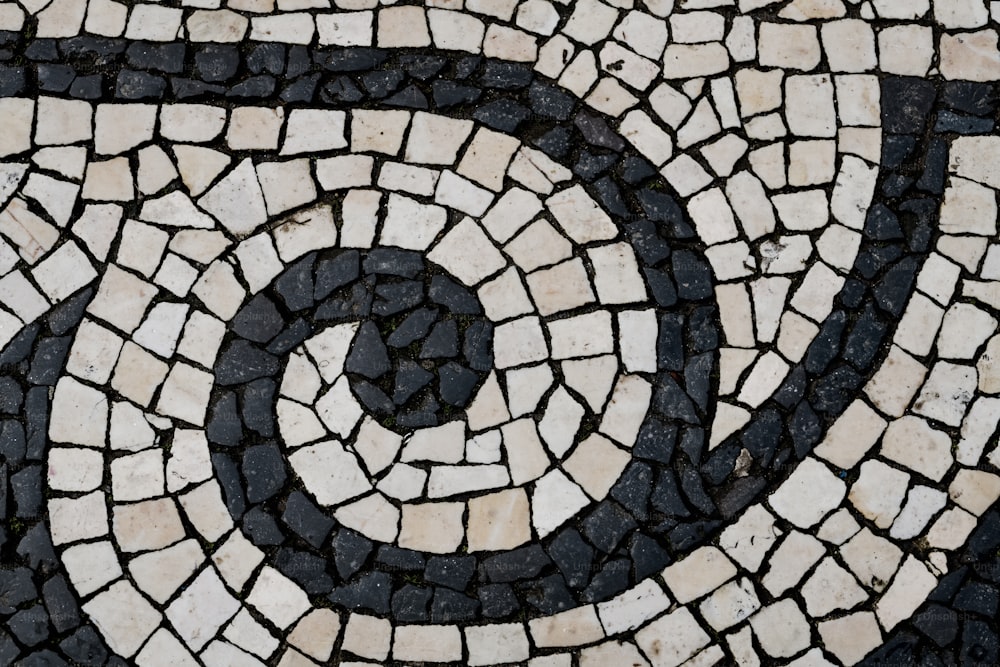 a close up of a black and white tile pattern