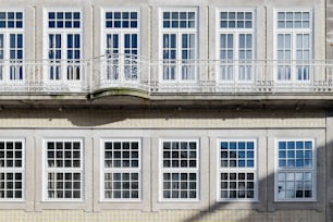 a building with many windows and balconies