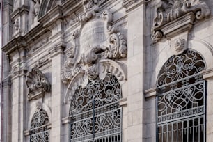 a close up of a building with ornate iron work