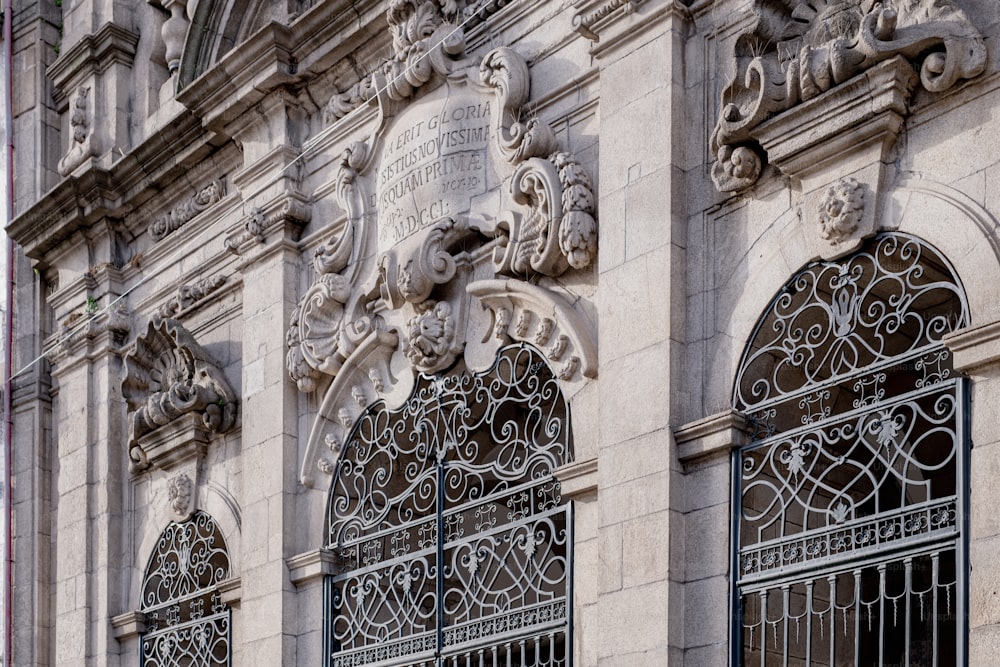 a close up of a building with ornate iron work