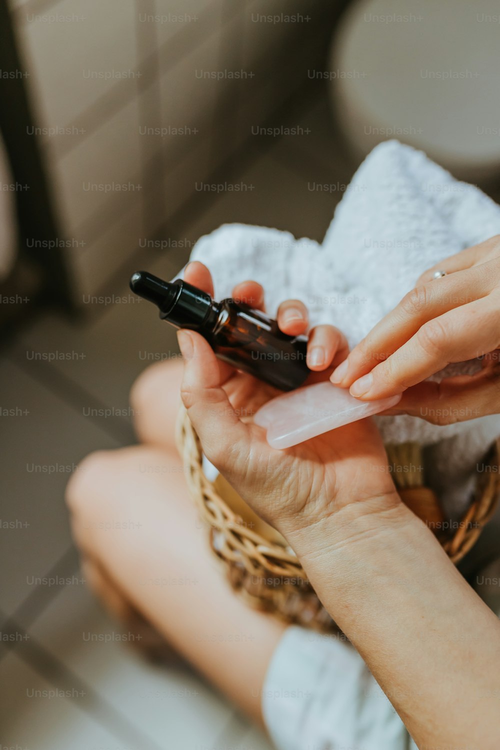 a woman sitting on the floor using a cell phone
