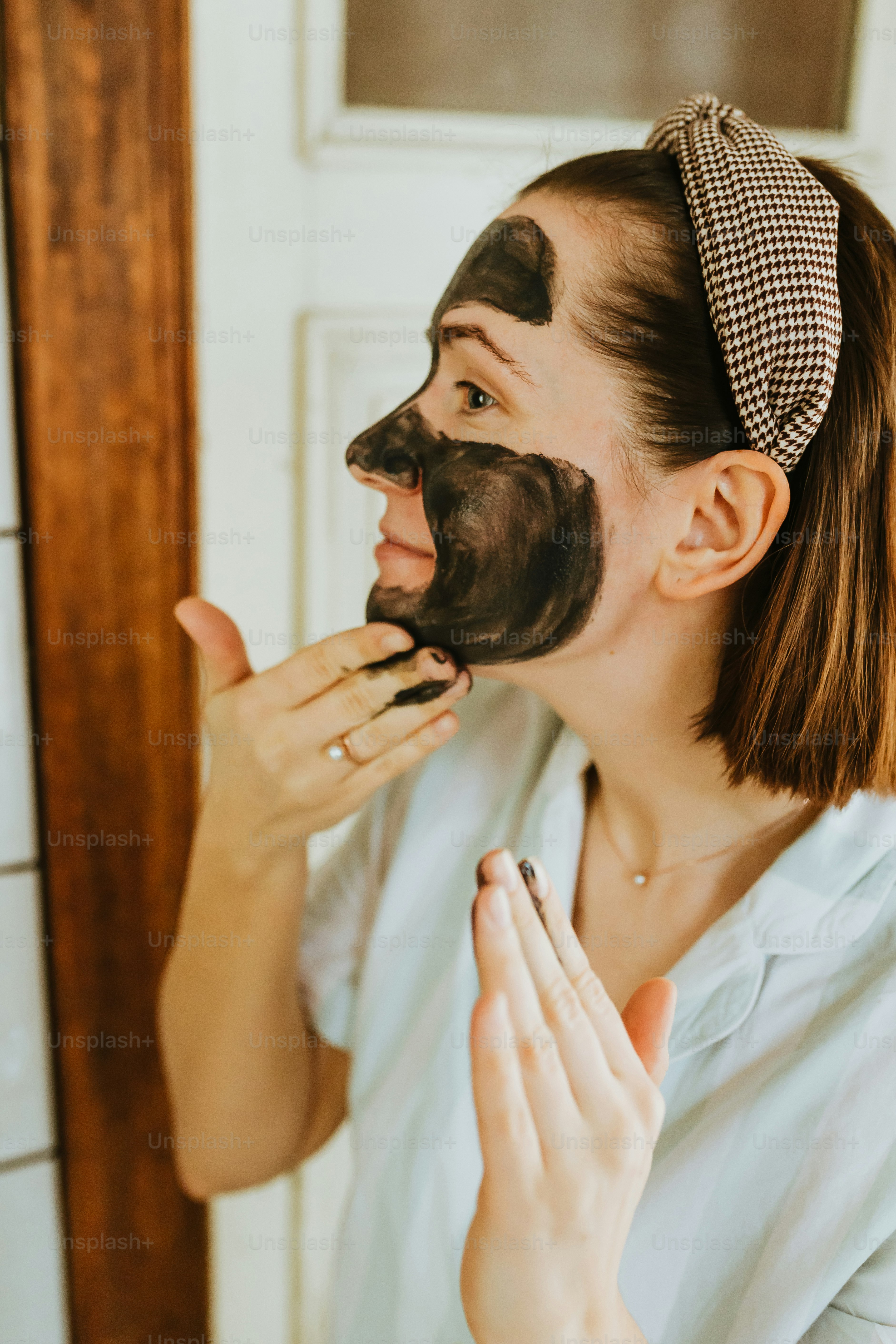 a woman with a black mask on her face