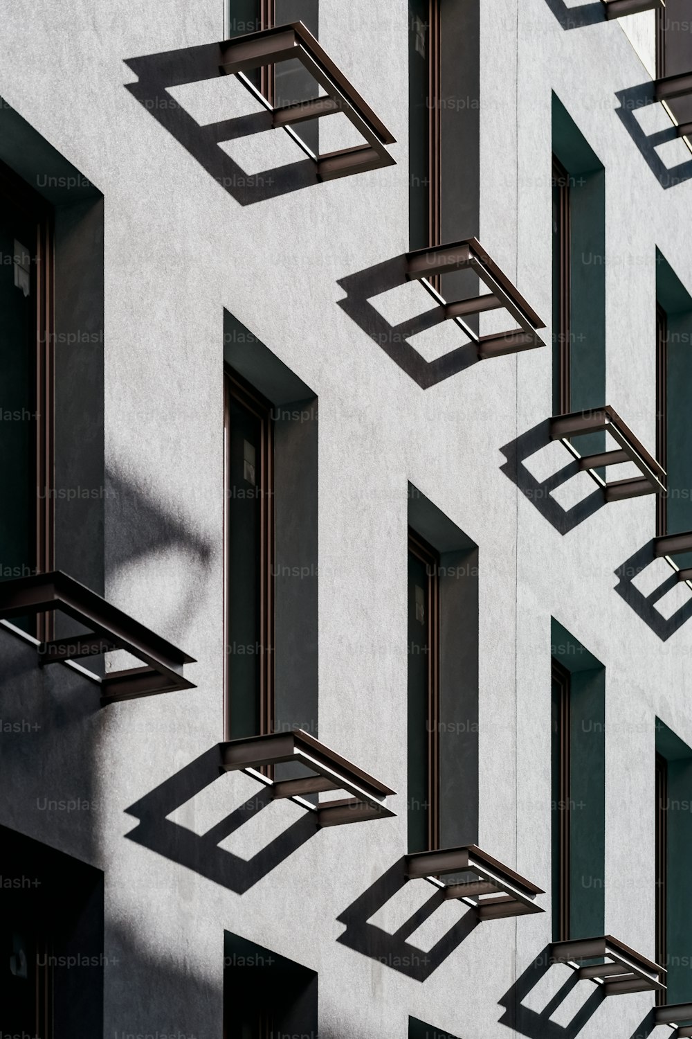 shadows cast on the side of a building